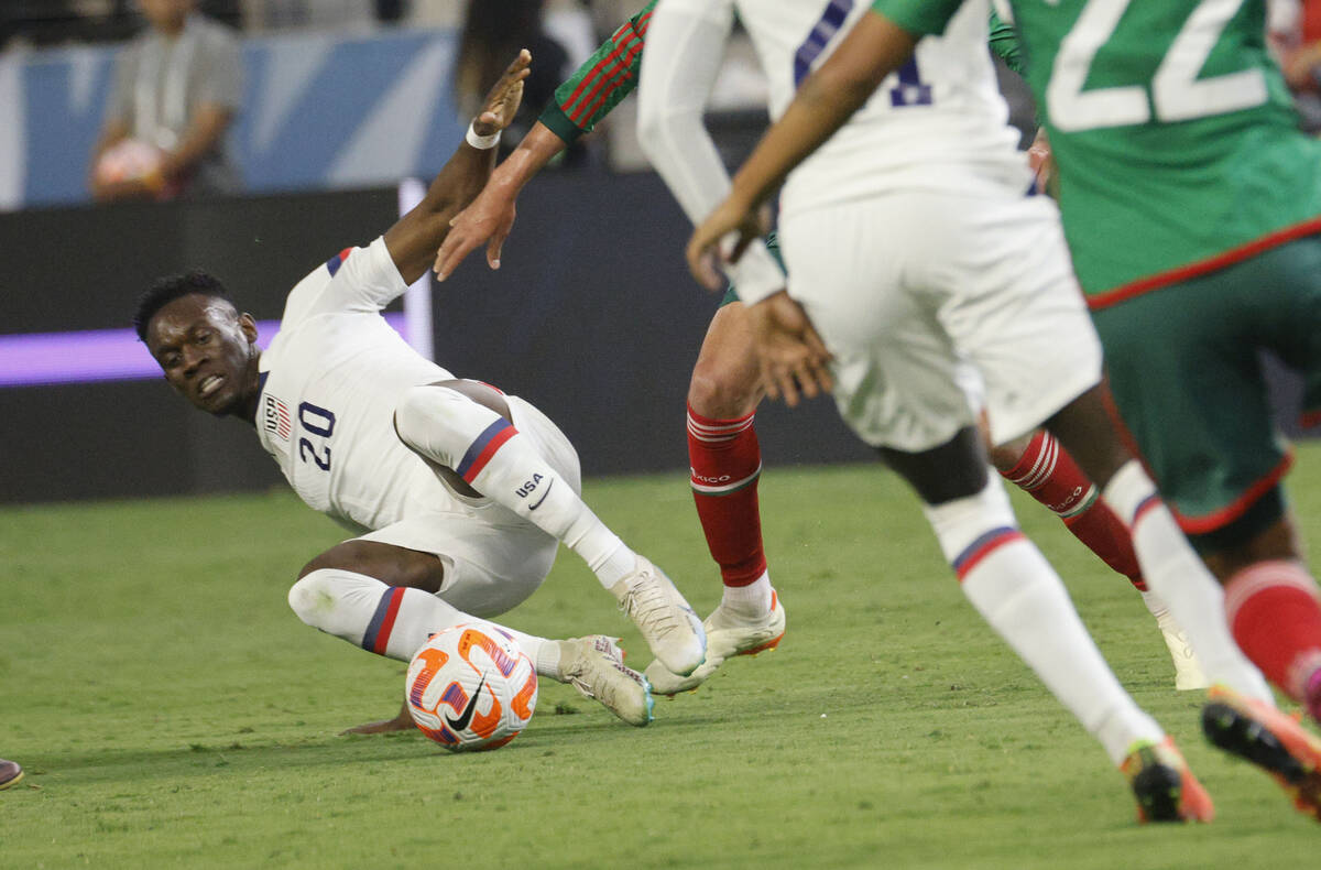 USA’s Folarin Balogun (20) tires to pass a ball during the first half of a CONCACAF Nati ...