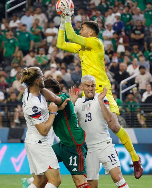 USA’s goalie Matthew Turner (1) makes a save during the second half of a CONCACAF Nation ...