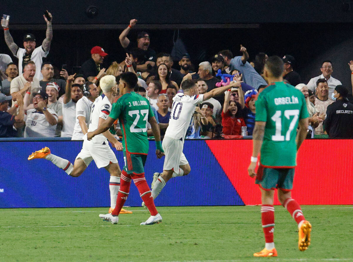 USA’s Christian Pulisic (10) celebrates after he scored a goal against Mexico during th ...