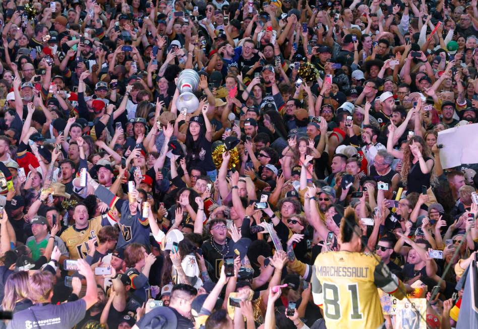 Golden Knights fans celebrate their team's Stanley Cup win against the Florida Panthers, outsid ...