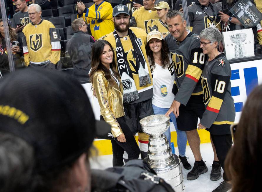 Golden Knights center Nicolas Roy (10) poses for a photo with his family and the Stanley Cup af ...