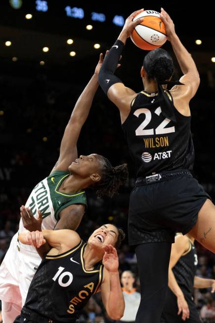 Las Vegas Aces forward A'ja Wilson (22) snags a rebound from Seattle Storm guard Jewell Loyd (2 ...