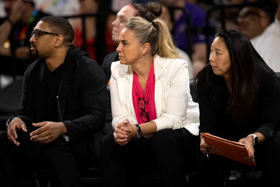Las Vegas Aces assistant coach Tyler Marsh, head coach Becky Hammon and first assistant coach N ...