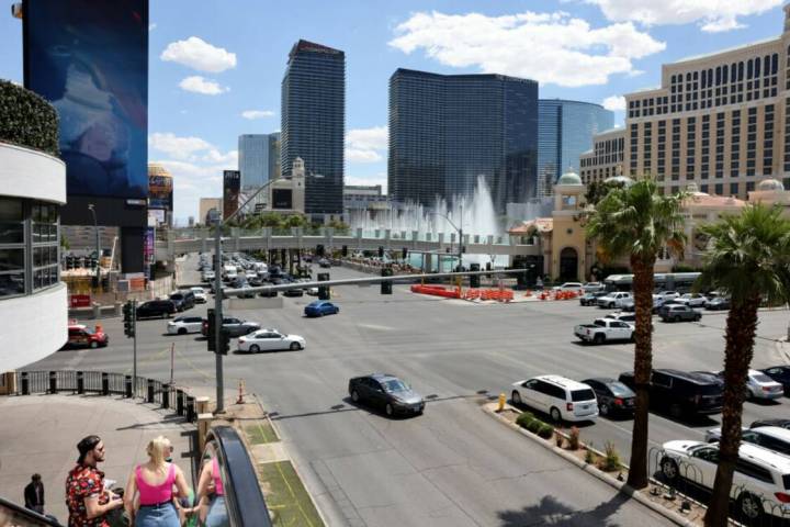 Traffic and pedestrians move at the intersection of Las Vegas Boulevard and Flamingo Road on th ...