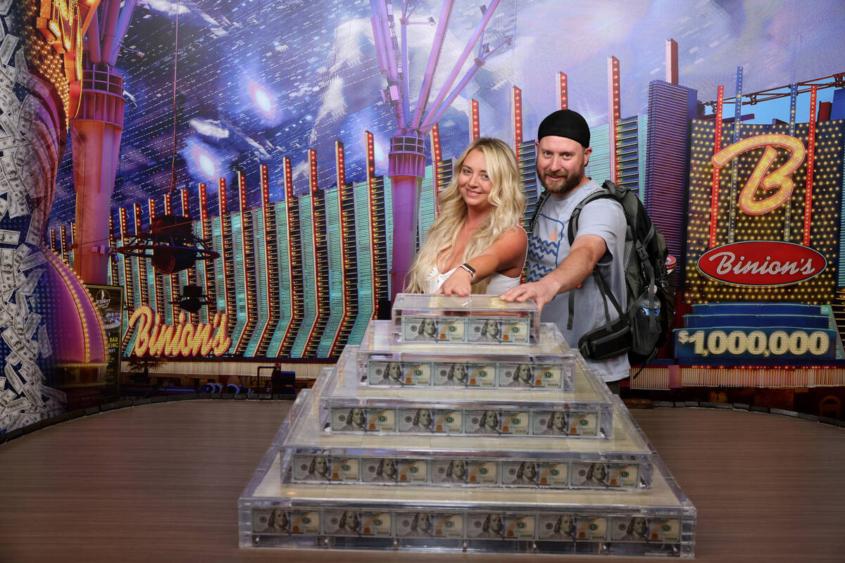 Jennifer and JP Scott of Layton, Utah pose with the new Million Dollar Display at Binion's in d ...