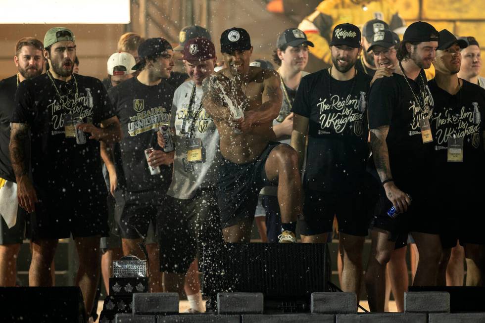 Golden Knights right wing Keegan Kolesar (55) sprays champagne on the crowd during Knights Stan ...