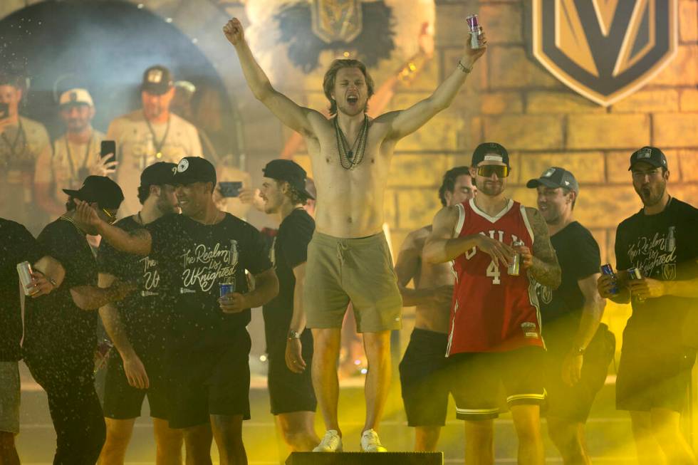 Golden Knights center William Karlsson cheers toward the crowd as the Knights take the stage to ...