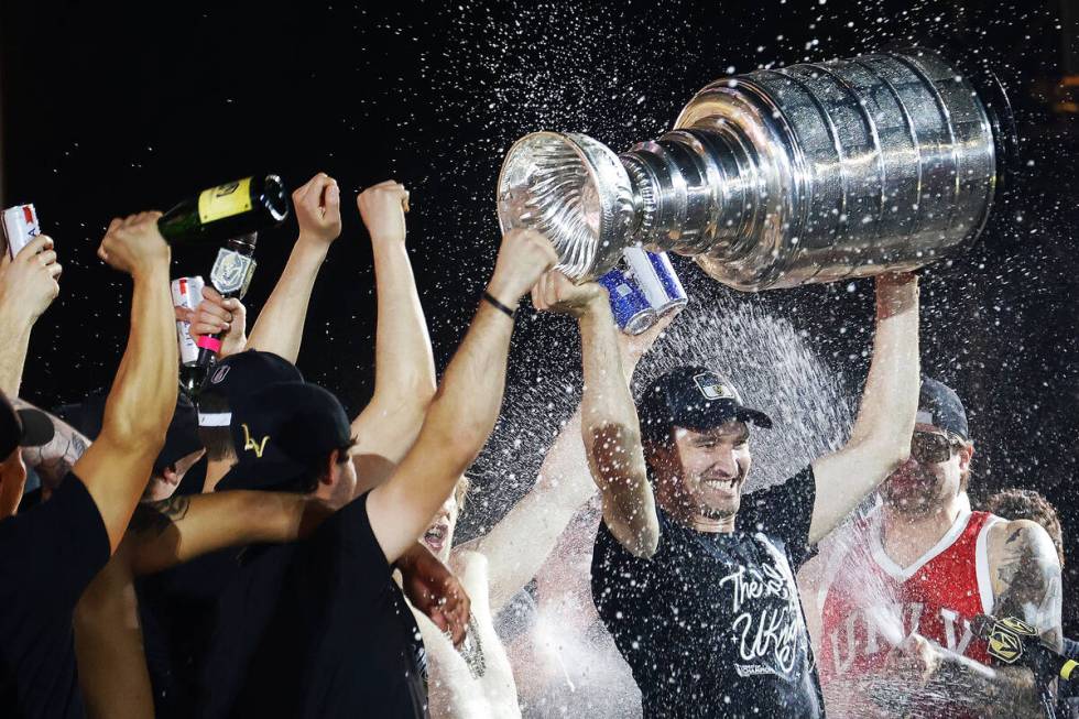 Golden Knights right wing Mark Stone hoists the Stanley Cup during a rally at Toshiba Plaza aft ...