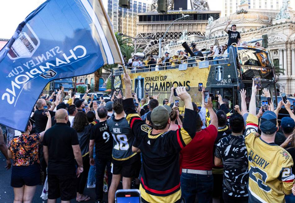 Golden Knights fans and players celebrate during a parade to mark their team's Stanley Cup win, ...
