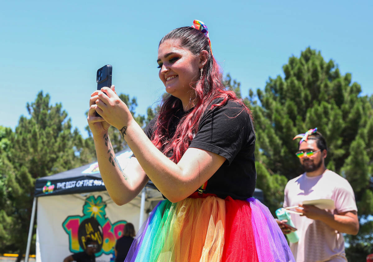 Camryn Lommason takes a photo of friends at the 3rd annual LGBTQ Henderson Pride Festival on Sa ...