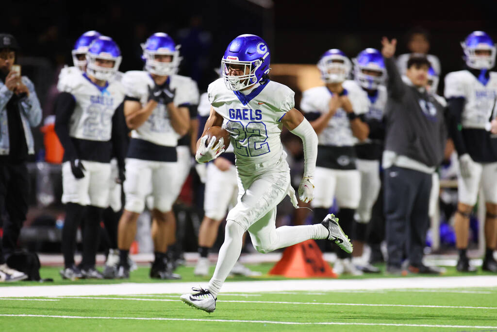 Bishop Gorman's Micah Kaapana (22) runs the ball for a touchdown during the second half of the ...