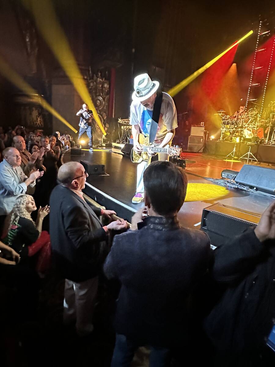 Carlos Santana is shown playing for Clive Davis at Beacon Theatre in New York, after a premiere ...