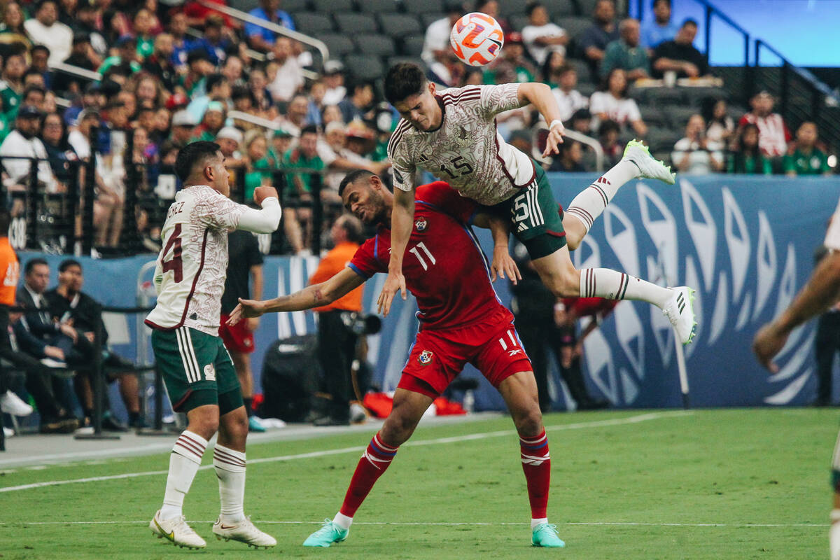 Mexico’s Israel Reyes (15) dives over Panama’s Ismael Díaz (11) during the C ...