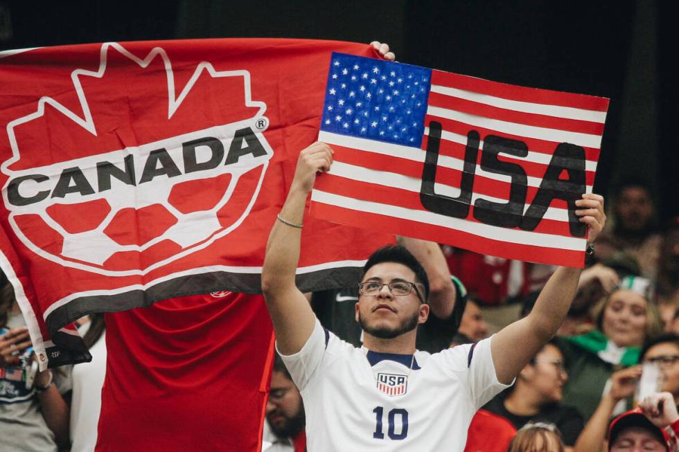 A Team USA fan waves a poster in the air during the CONCACAF Nations League final match against ...