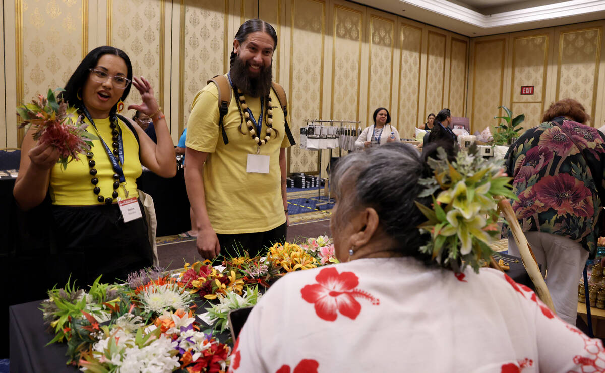 Denise and Phillip Melendrez of Phoenix buy floral hair combs from Paula Alcain owner of Anniek ...