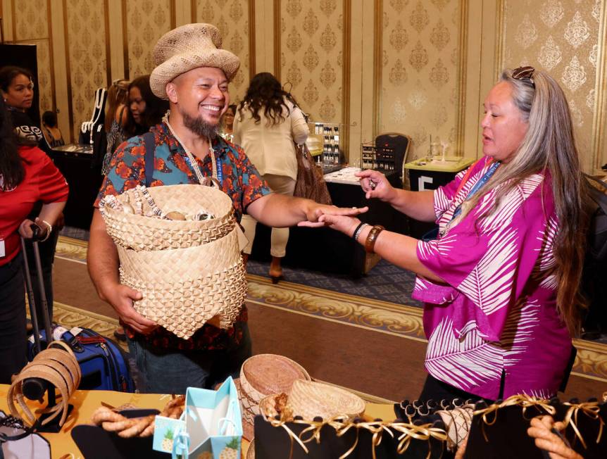 Makaio Villanueva, left, and Nani Peterson of Wai’anae, Hawaii check out Hawaiian cultur ...