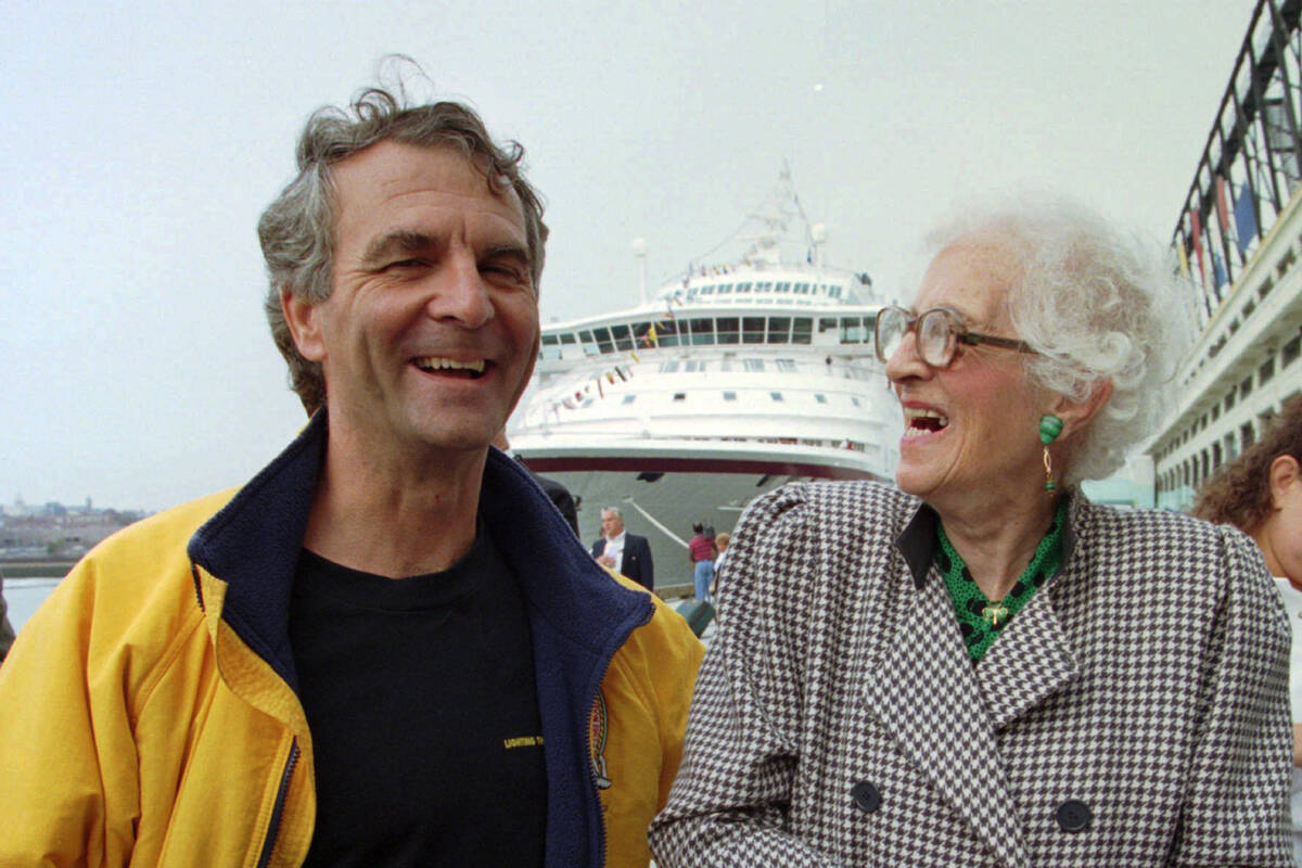 FILE - Commander Paul-Henry Nargeolet, left, laughs with Millvina Dean, 84, of England at the B ...