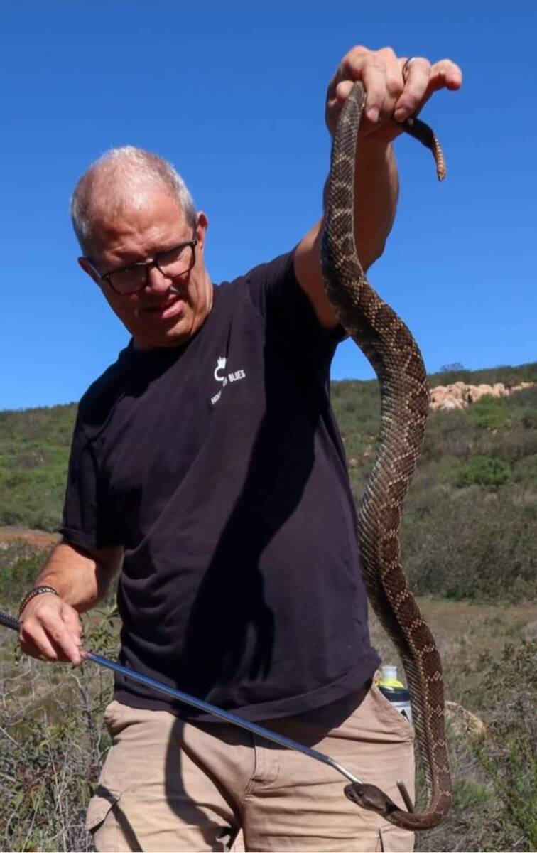 Tim Agnello holding a snake. (Camryn Agnello)
