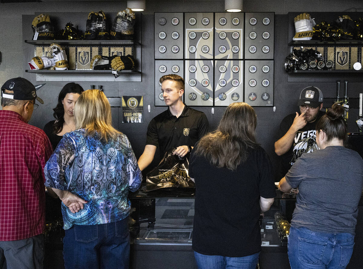 Golden Knights fans check out Stanley Cup championship merchandise at The Arsenal at City Natio ...