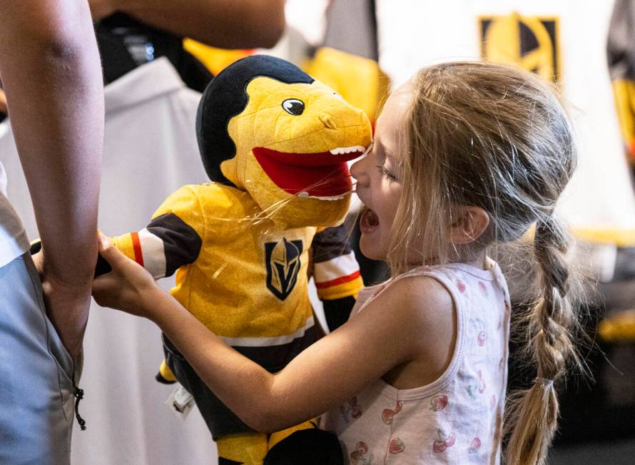 Macey Lebaron, 4, plays with Golden Knights stuffed mascot Chance at The Arsenal at City Nation ...