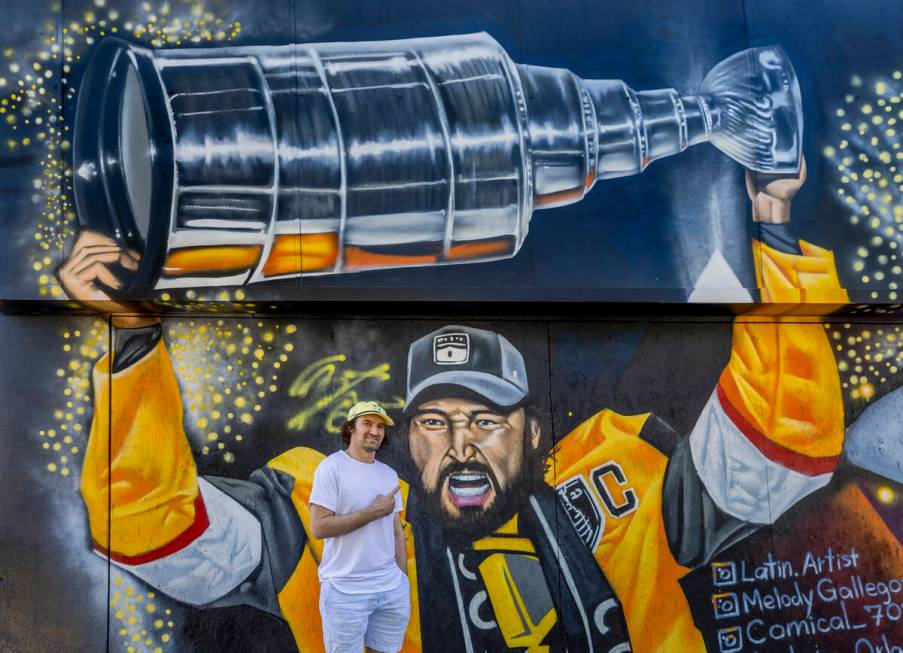 Golden Knights Mark Stone at a new mural of him holding the Stanley Cup painted by artists in t ...