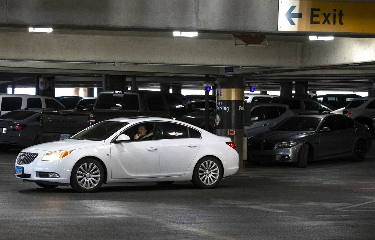A passenger looks for a parking space at the level 2 of Terminal 1 parking lot at Harry Reid in ...