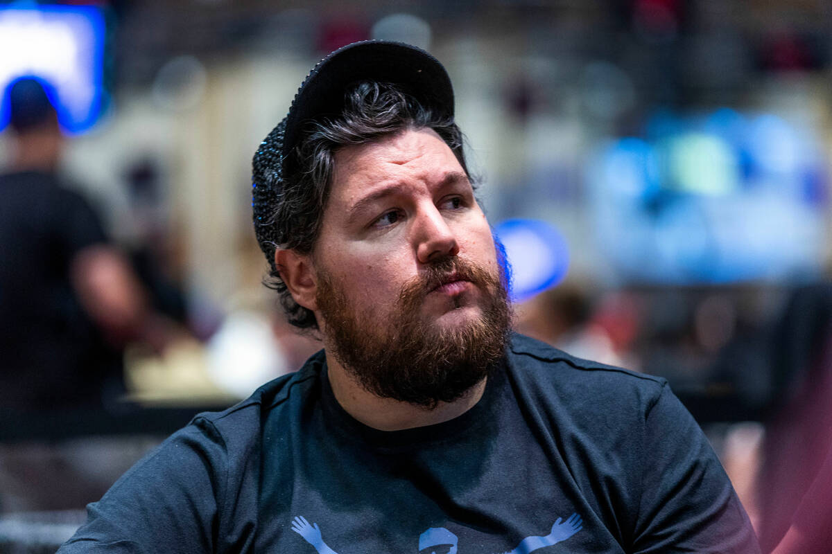 Poker player Shaun Deeb watches the action about the room from his table during the WSOP in the ...
