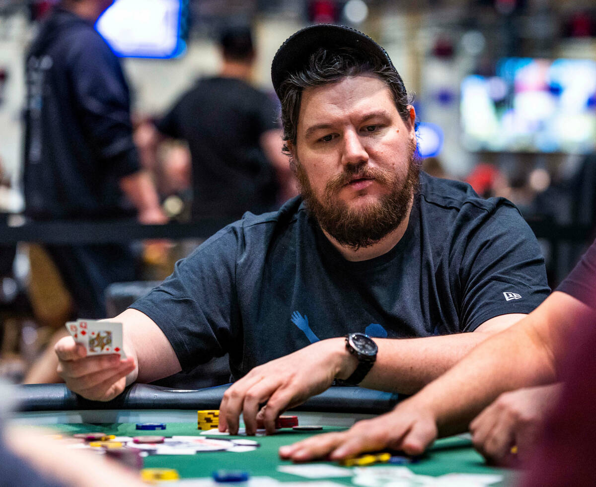 Poker player Shaun Deeb shows his pocket queens at his table during the WSOP in the Paris on Fr ...