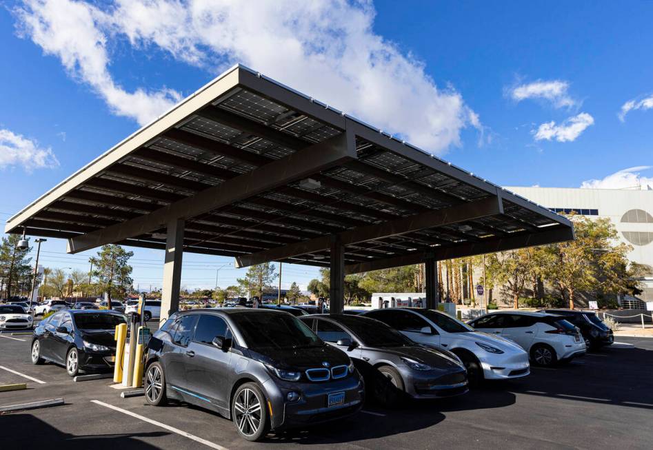 Electric vehicles get their battery recharged in the parking lot of NV Energy's headquarters at ...