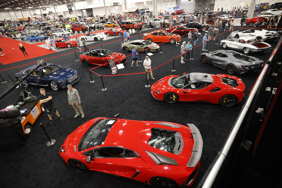People walk around during the Barrett-Jackson Auction at the Las Vegas Convention Center, Frida ...