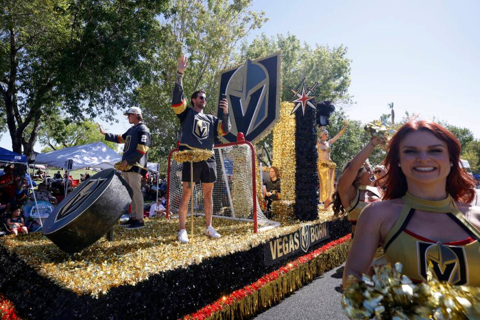 Golden Knights defenseman Zach Whitecloud, left, and goaltender Logan Thompson, center, ride th ...