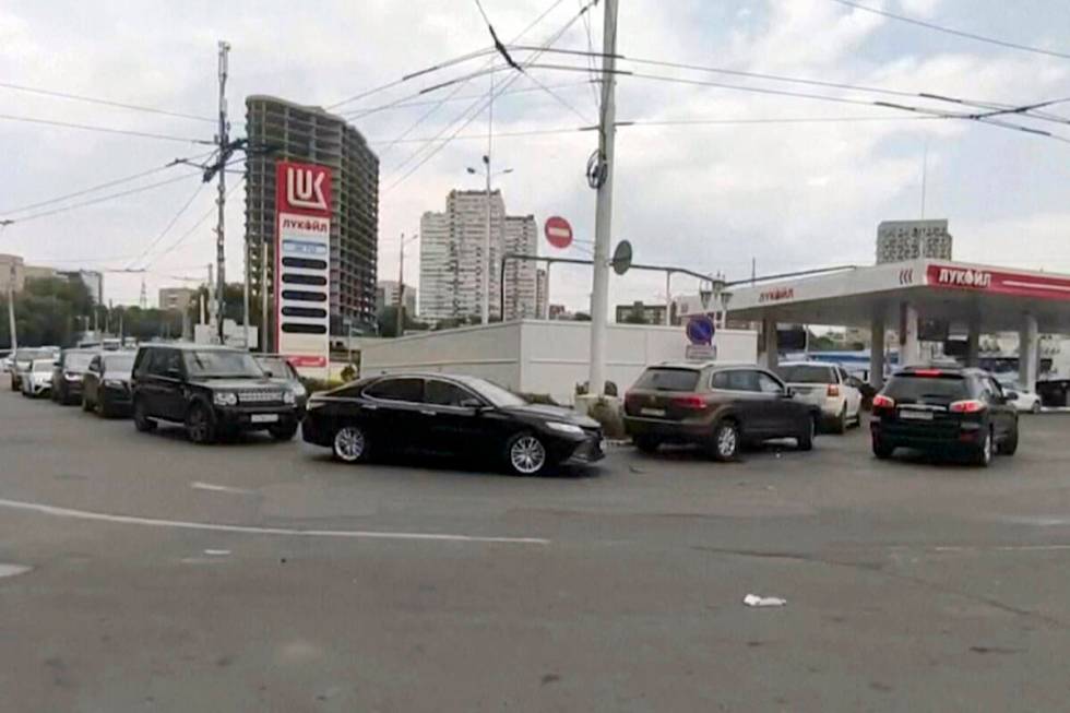In this photo taken from video, cars line up at a petrol station in Rostov-on-Don, Russia, Satu ...