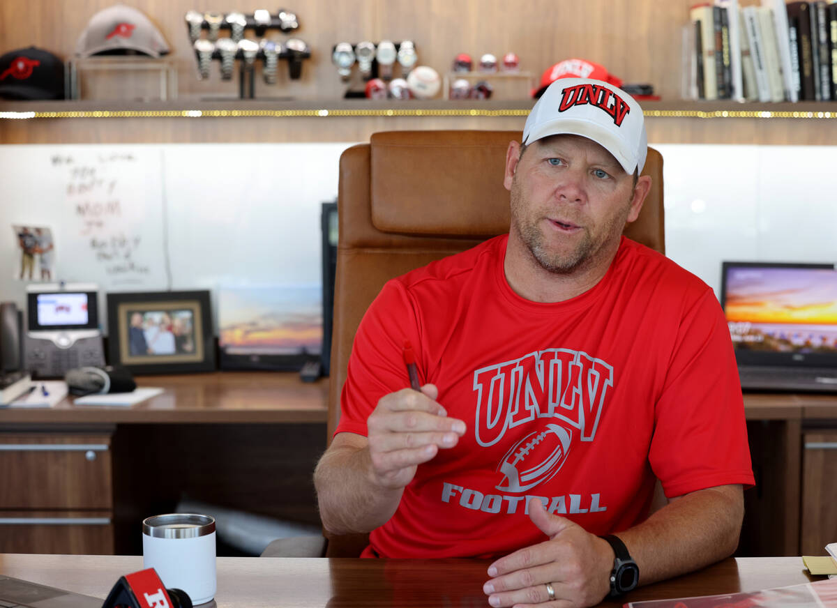 UNLV football coach Barry Odom talks to a reporter at his office in the Fertitta Football Compl ...