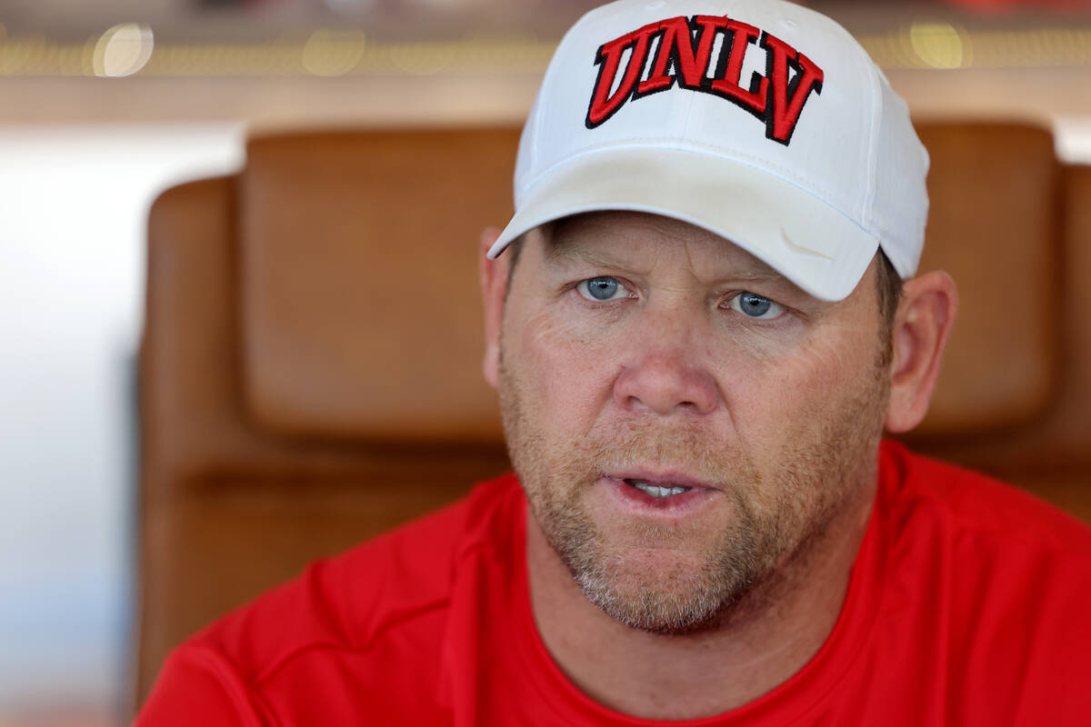 UNLV football coach Barry Odom talks to a reporter at his office in the Fertitta Football Compl ...