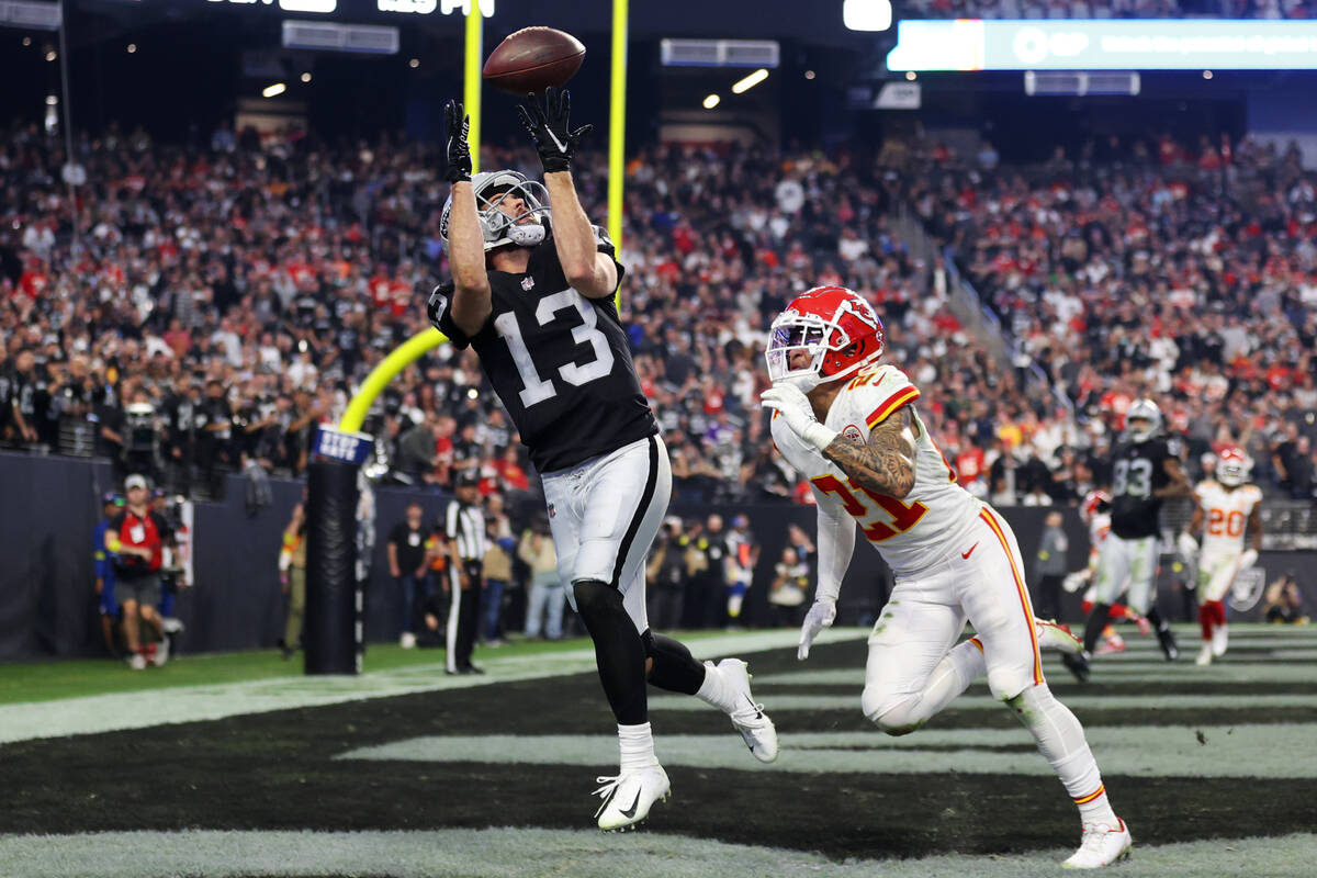 Las Vegas Raiders wide receiver Hunter Renfrow (13) receives a pass for a touchdown under press ...