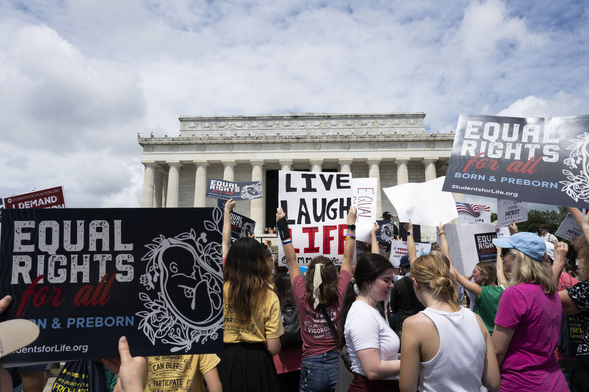 Anti-abortion activists rally at the National Celebrate Life Rally at the Lincoln Memorial on S ...