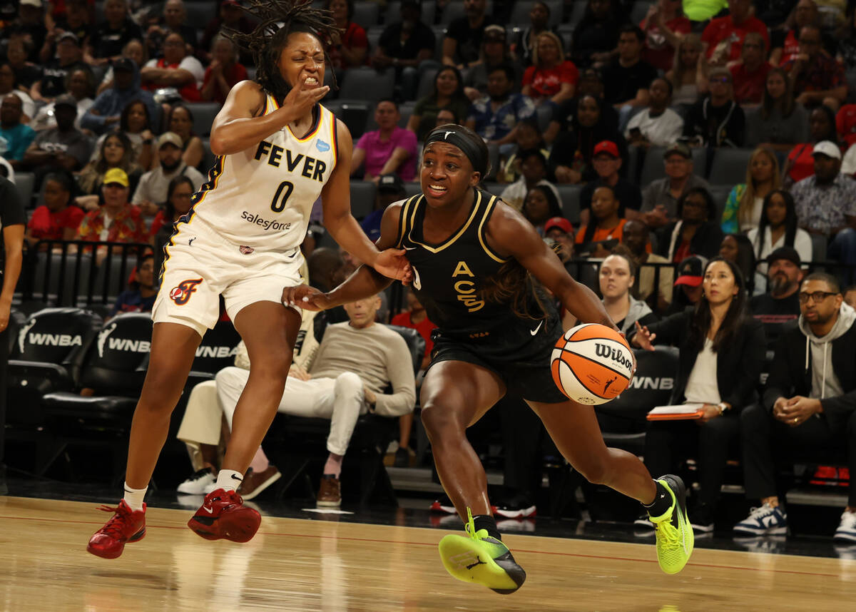 Las Vegas Aces guard Jackie Young (0) drives the ball to the hoop during a game against the Ind ...