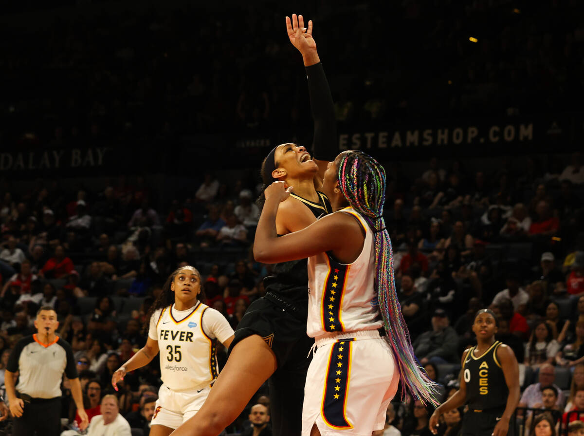 Las Vegas Aces center A'ja Wilson (22) takes a shot as Indiana Fever forward/center Aliyah Bost ...