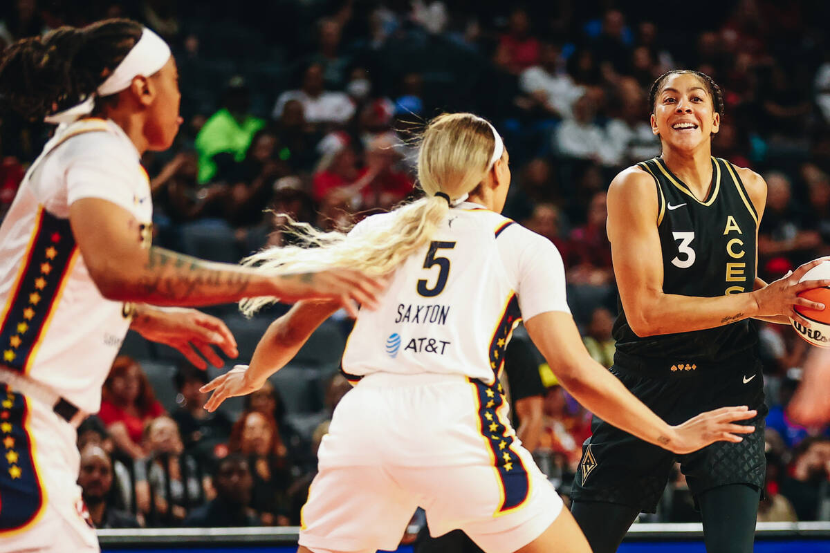 Las Vegas Aces forward/center Candace Parker tries to pass the ball to a teammate as Indiana Fe ...