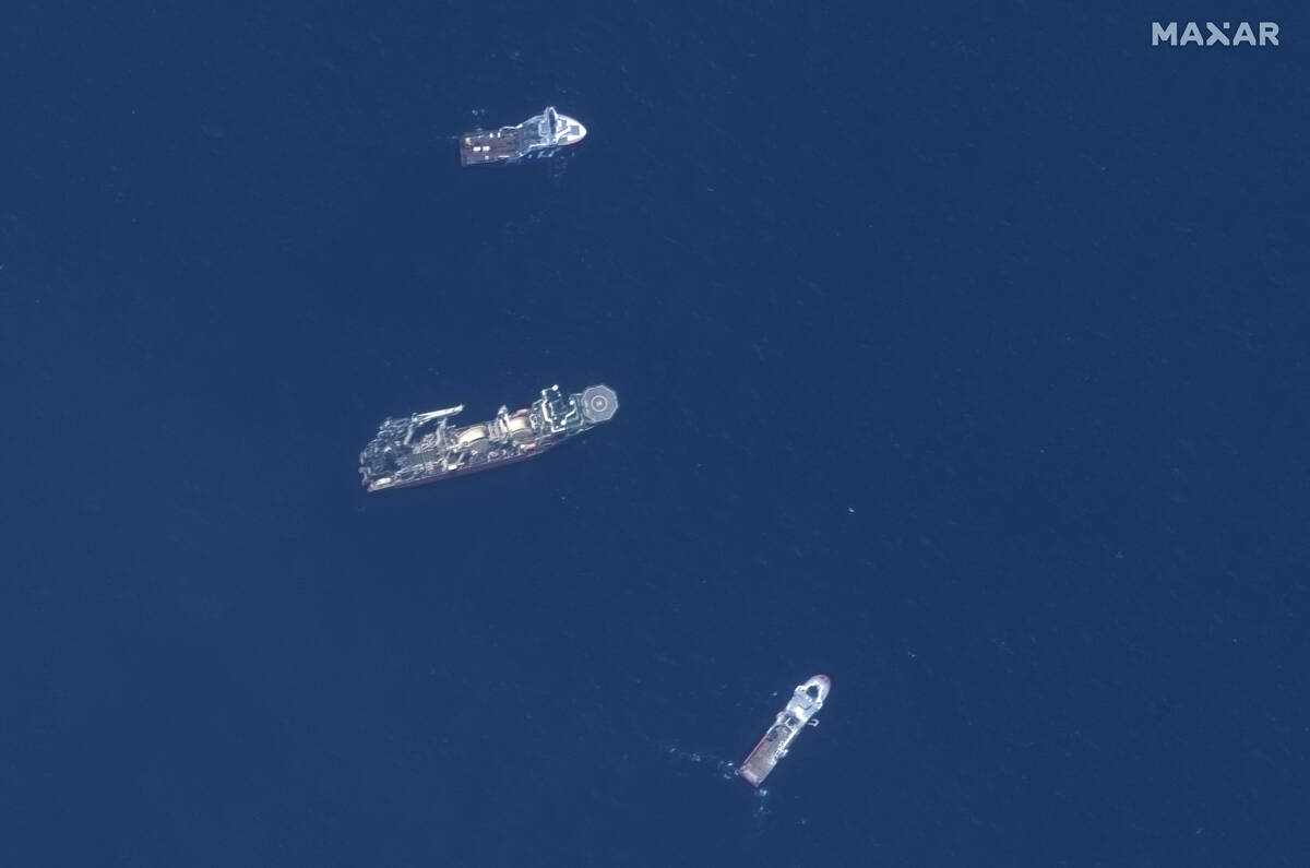 In this satellite image provided by Maxar Technologies, from top to bottom, the vessels Horizon ...