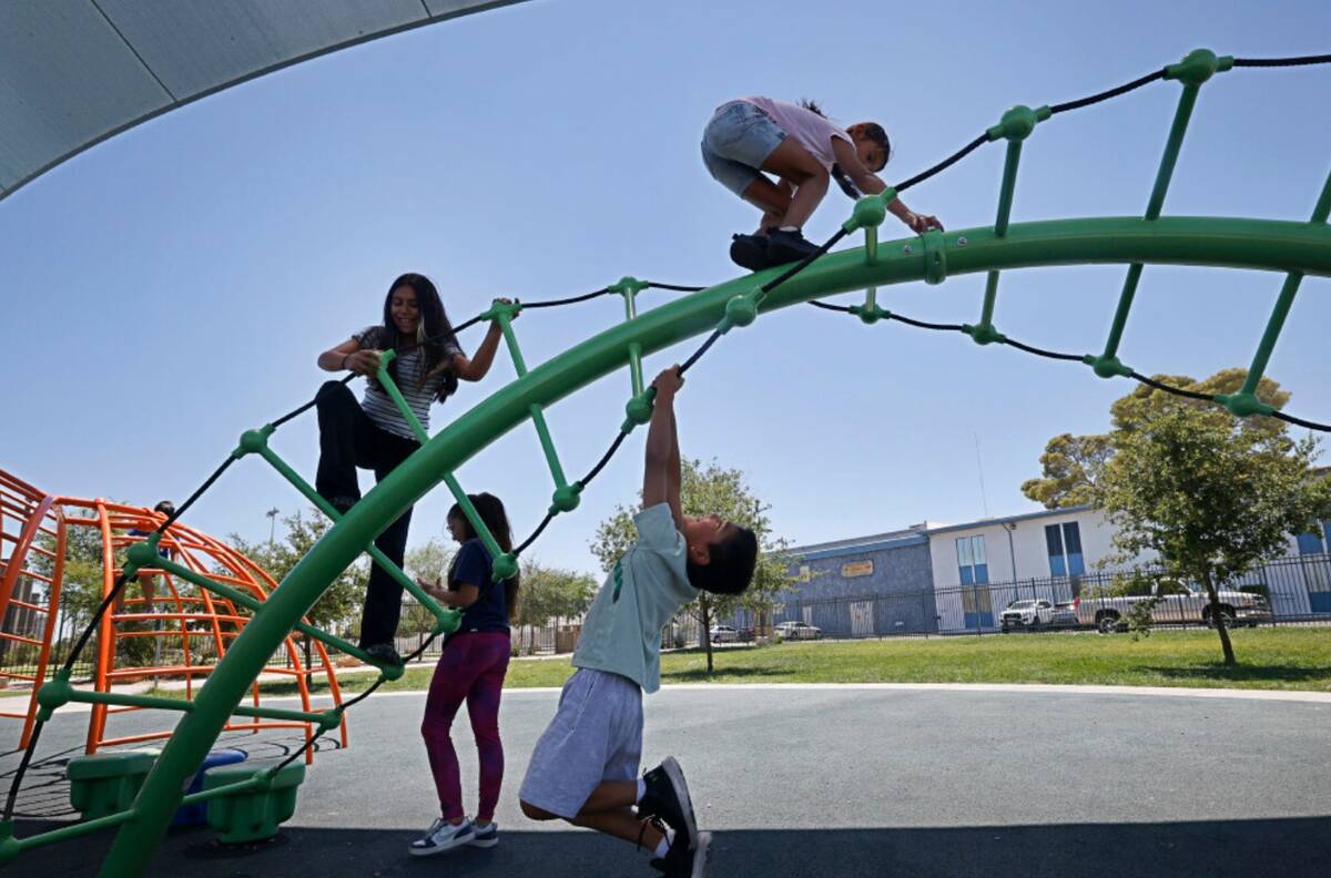 Sebastian Sotelo, 7, of Las Vegas, center, plays with his sisters Jane, 11, from left, Gabby, 1 ...