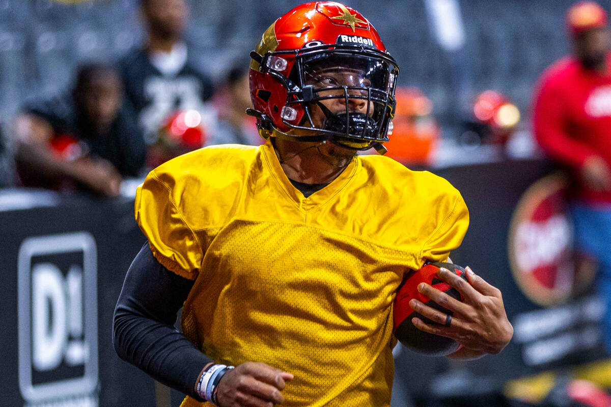 Vegas Knight Hawks quarterback Daquan Neal heads for the end zone during practice at The Dollar ...