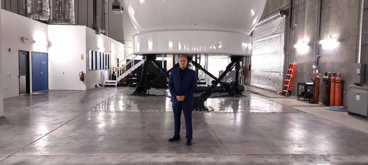Las Vegas Spaceport CEO Rob Lauer stands in front of a flight simulator at Las Vegas Flight Aca ...