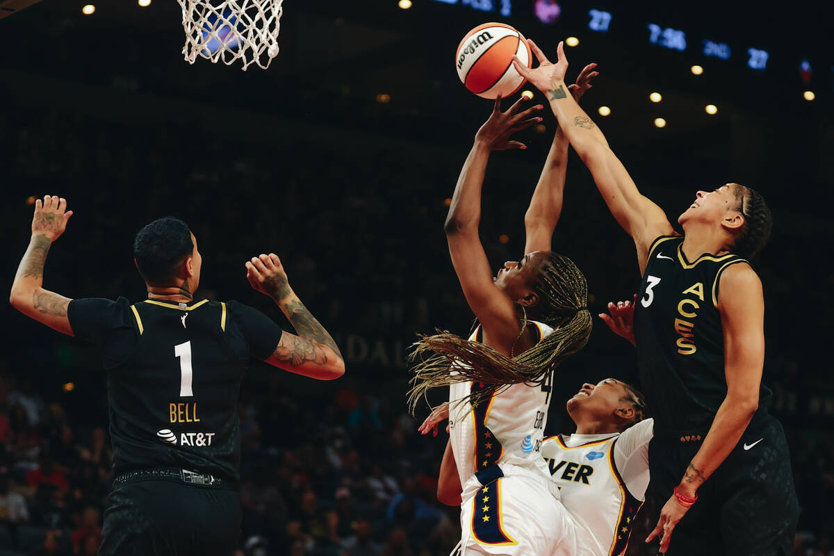 Las Vegas Aces forward/center Candace Parker (3) reaches to grab the ball for a rebound as Indi ...