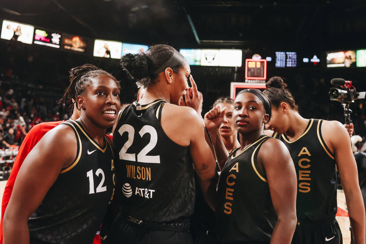 The Las Vegas Aces break out of a group huddle after beating the Indiana Fever 88-80 on Monday, ...
