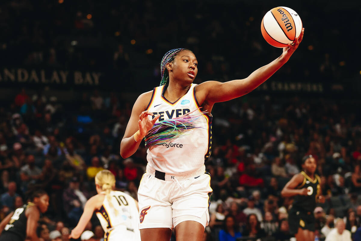 Indiana Fever forward/center Aliyah Boston grabs the ball as it comes down from the hoop after ...