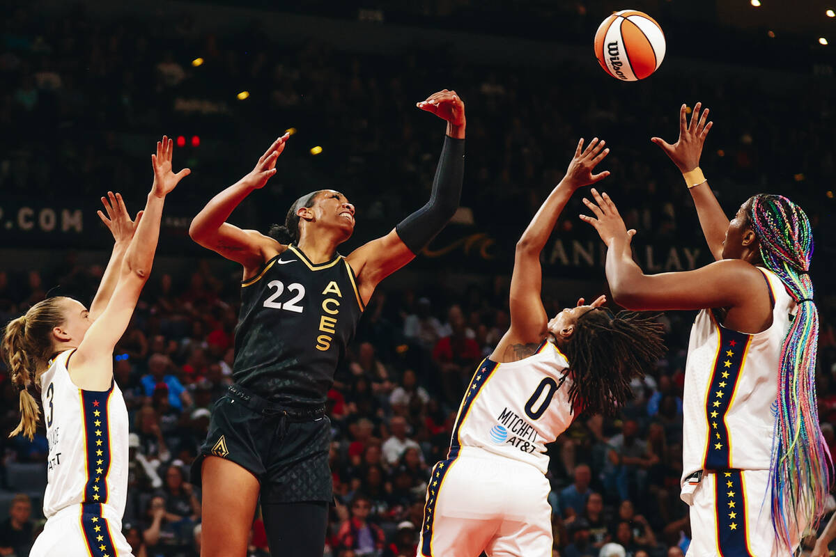 Las Vegas Aces center A’ja Wilson struggles to grab the ball for a rebound in a game aga ...
