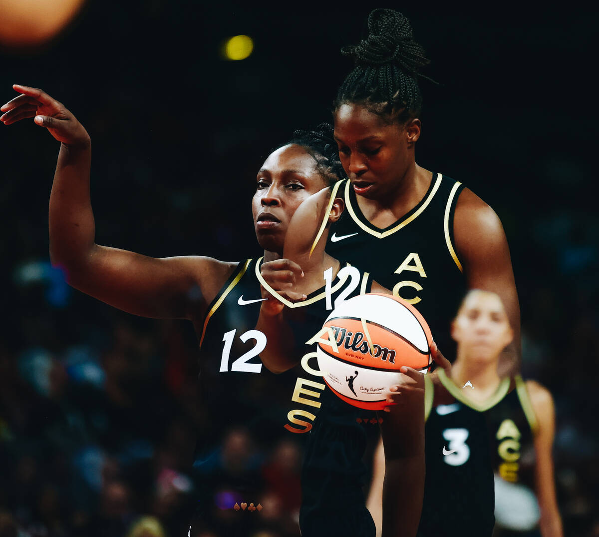 In a double exposure photo, Las Vegas Aces guard Chelsea Gray attempts a free throw in a game a ...