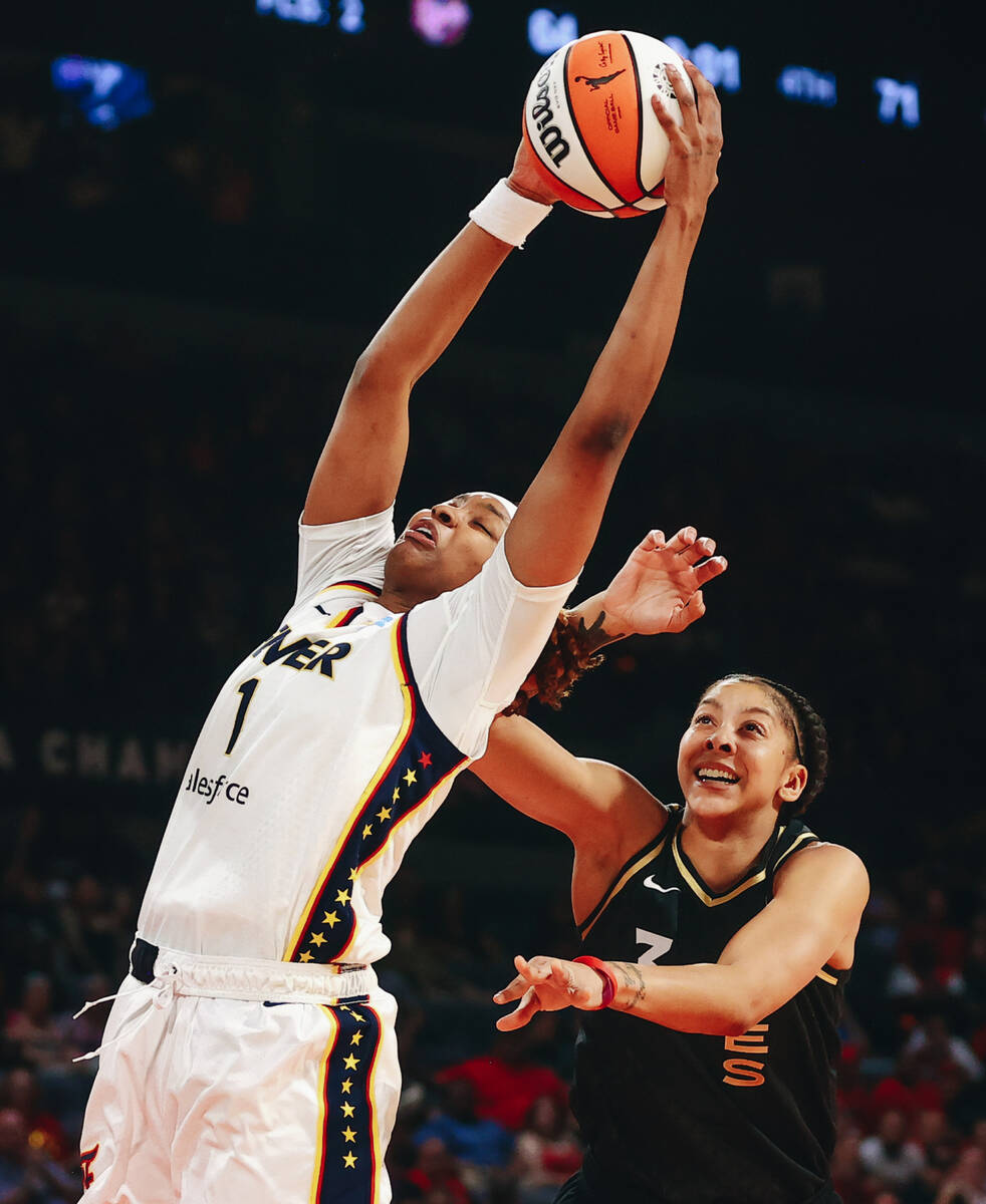 Indiana Fever forward NaLyssa Smith (1) grabs the ball as it comes down from the net as Las Veg ...