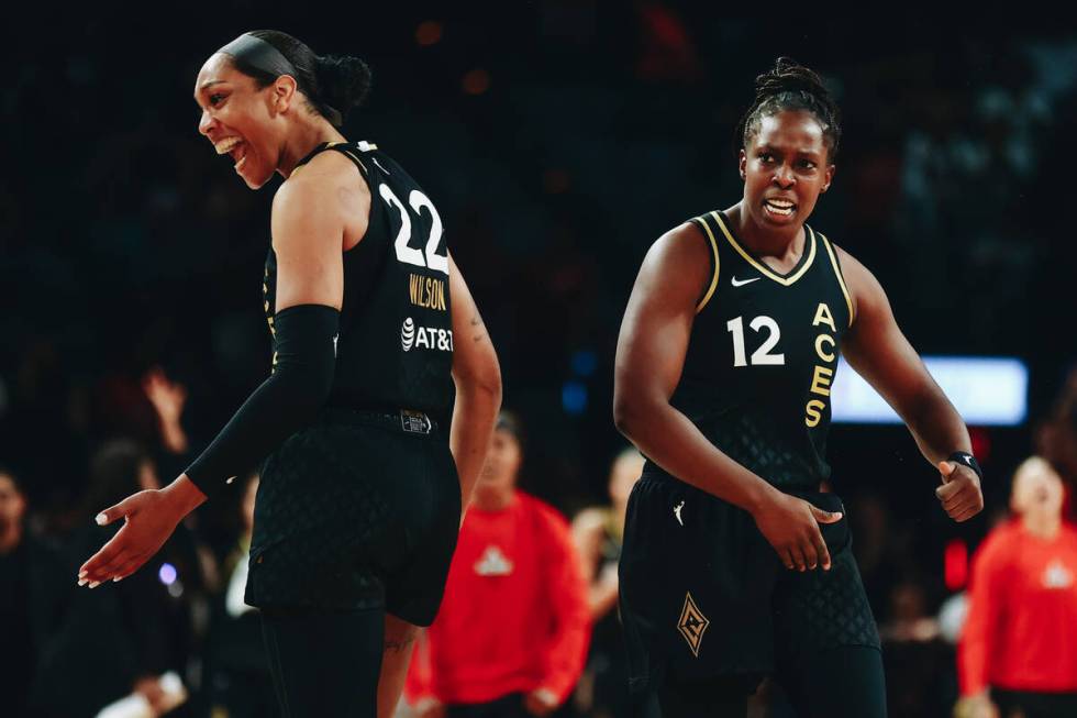 Las Vegas Aces teammates A’ja Wilson (22) and Chelsea Gray (12) celebrate a basket made ...